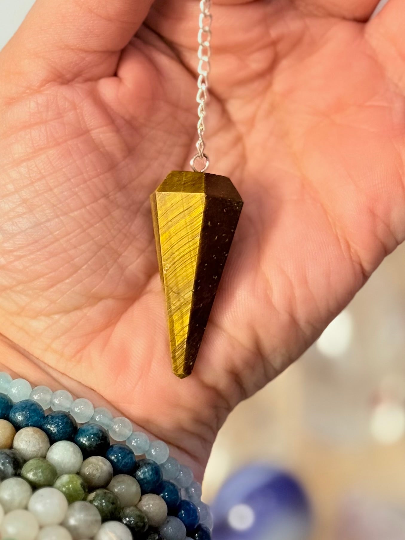 Péndulo facetado Ojo de Tigre | Foco y Claridad